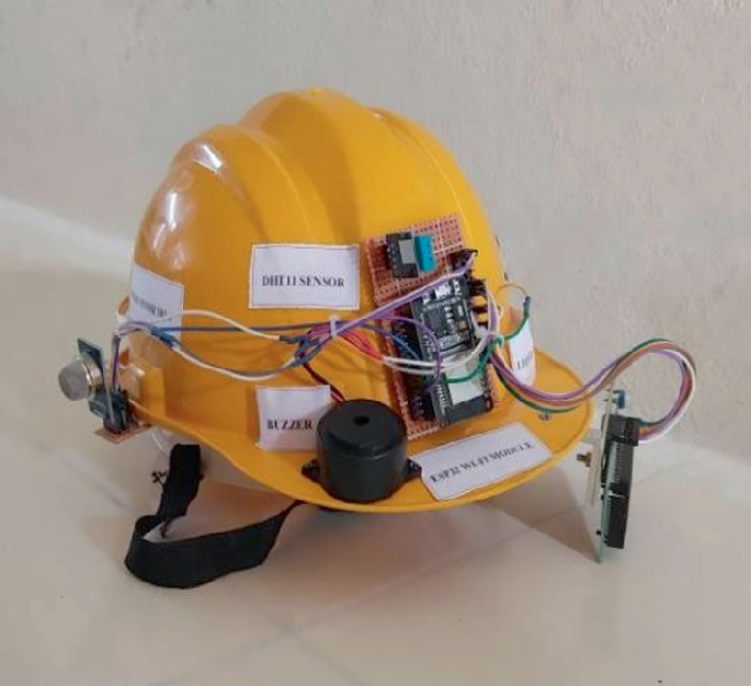 Mining Workers Safety Helmet IoT device showing sensors and alert features